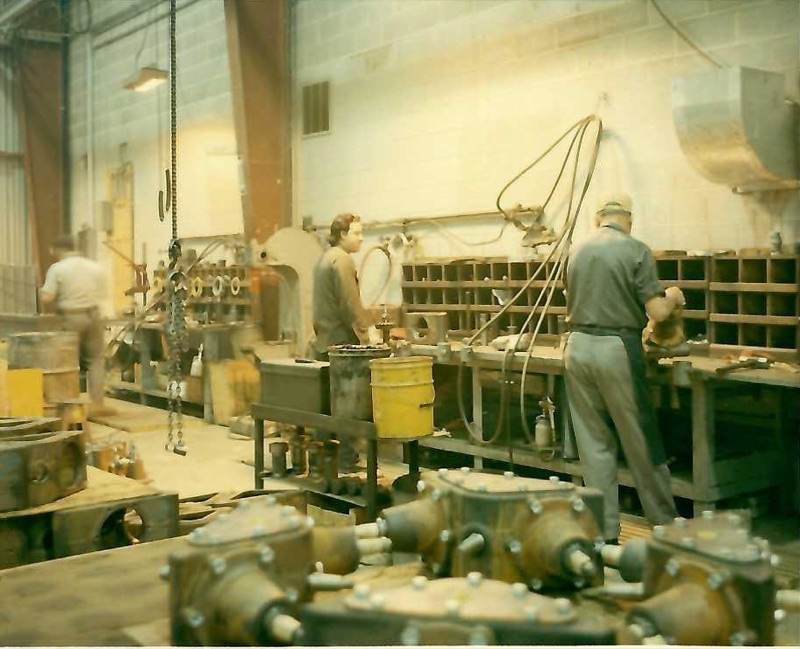 Workers assembling Aitken Products infrared heaters on the factory floor